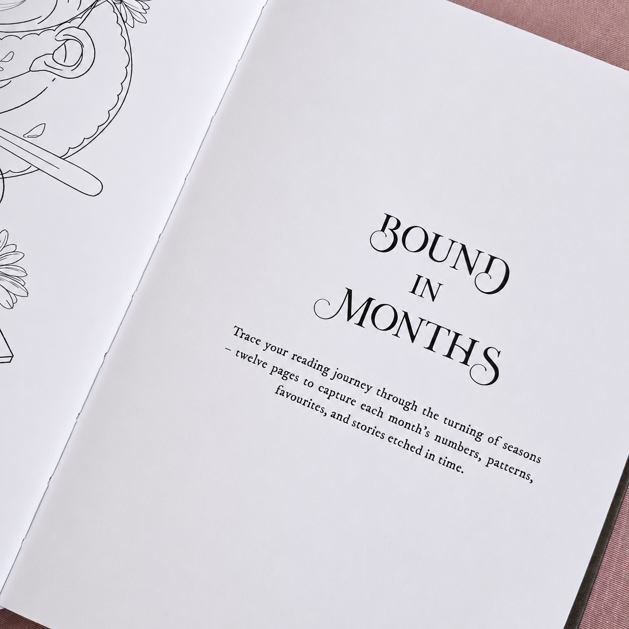 Close-up of the Tales in Ink Reading Journal gold foil cover detailing and vegan leather texture